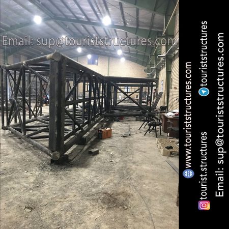 construction, color and carrying the structure, Location of metal frame factory (derrick and structures) of the aerial restaurant project in Ferdows Garden of Isfahan, Pasargad’s professional forces in welding, cutting and assembly at the factory, Steps to build the derrick for the aerial restaurant inside the factory in project of Ferdows Garden, Isfahan, Painting of project structures (with polyurethane paint, 120 microns thick) inside the factory in Ferdows Garden, Isfahan, Carrying of the project structures from the factory to the project site (in Ferdows Garden, Isfahan)