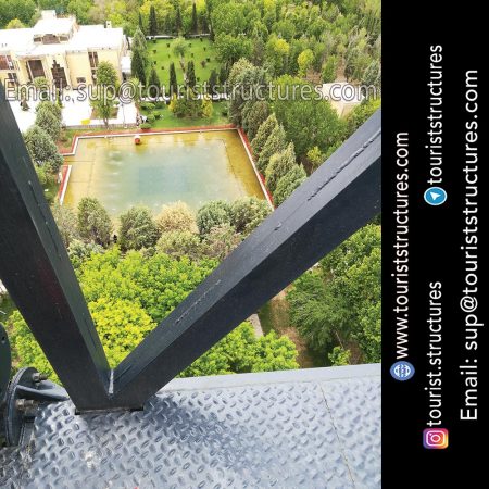 Beautiful view of the Project construction location of Ferdows Garden, the top of the derrick of the aerial restaurant in Isfahan (it is located behind Atashgah Mountain), Beautiful pictures from project construction location by Quadcopter in Ferdows Garden of Isfahan, Beautiful view from Atashgah Mountain from inside the aerial restaurant in Ferdows Garden of Isfahan, The ground of project construction of the aerial restaurant of Ferdows Garden, Isfahan before civil operation, 3D view of the aerial restaurant and its derrick in project of Ferdows Garden of Isfahan, Project of the aerial restaurant pick-axing ceremony in Ferdows Garden of Isfahan, Project introduction banner (installed at the construction location) and Pasargad Company logo (the company logo is installed on the structures)