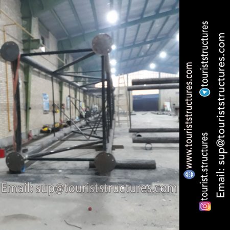 construction, color and carrying the structure, Location of metal frame factory (derrick and structures) of the aerial restaurant project in Ferdows Garden of Isfahan, Pasargad’s professional forces in welding, cutting and assembly at the factory, Steps to build the derrick for the aerial restaurant inside the factory in project of Ferdows Garden, Isfahan, Painting of project structures (with polyurethane paint, 120 microns thick) inside the factory in Ferdows Garden, Isfahan, Carrying of the project structures from the factory to the project site (in Ferdows Garden, Isfahan)