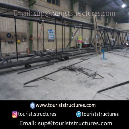 construction, color and carrying the structure, Location of metal frame factory (derrick and structures) of the aerial restaurant project in Ferdows Garden of Isfahan, Pasargad’s professional forces in welding, cutting and assembly at the factory, Steps to build the derrick for the aerial restaurant inside the factory in project of Ferdows Garden, Isfahan, Painting of project structures (with polyurethane paint, 120 microns thick) inside the factory in Ferdows Garden, Isfahan, Carrying of the project structures from the factory to the project site (in Ferdows Garden, Isfahan)