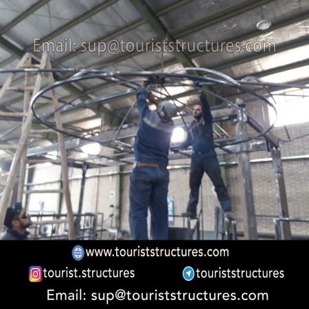 construction, color and carrying the structure, Location of metal frame factory (derrick and structures) of the aerial restaurant project in Ferdows Garden of Isfahan, Pasargad’s professional forces in welding, cutting and assembly at the factory, Steps to build the derrick for the aerial restaurant inside the factory in project of Ferdows Garden, Isfahan, Painting of project structures (with polyurethane paint, 120 microns thick) inside the factory in Ferdows Garden, Isfahan, Carrying of the project structures from the factory to the project site (in Ferdows Garden, Isfahan)