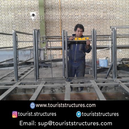 construction, color and carrying the structure, Location of metal frame factory (derrick and structures) of the aerial restaurant project in Ferdows Garden of Isfahan, Pasargad’s professional forces in welding, cutting and assembly at the factory, Steps to build the derrick for the aerial restaurant inside the factory in project of Ferdows Garden, Isfahan, Painting of project structures (with polyurethane paint, 120 microns thick) inside the factory in Ferdows Garden, Isfahan, Carrying of the project structures from the factory to the project site (in Ferdows Garden, Isfahan)