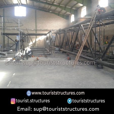 construction, color and carrying the structure, Location of metal frame factory (derrick and structures) of the aerial restaurant project in Ferdows Garden of Isfahan, Pasargad’s professional forces in welding, cutting and assembly at the factory, Steps to build the derrick for the aerial restaurant inside the factory in project of Ferdows Garden, Isfahan, Painting of project structures (with polyurethane paint, 120 microns thick) inside the factory in Ferdows Garden, Isfahan, Carrying of the project structures from the factory to the project site (in Ferdows Garden, Isfahan)