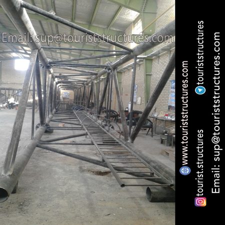 construction, color and carrying the structure, Location of metal frame factory (derrick and structures) of the aerial restaurant project in Ferdows Garden of Isfahan, Pasargad’s professional forces in welding, cutting and assembly at the factory, Steps to build the derrick for the aerial restaurant inside the factory in project of Ferdows Garden, Isfahan, Painting of project structures (with polyurethane paint, 120 microns thick) inside the factory in Ferdows Garden, Isfahan, Carrying of the project structures from the factory to the project site (in Ferdows Garden, Isfahan)