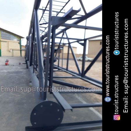 construction, color and carrying the structure, Location of metal frame factory (derrick and structures) of the aerial restaurant project in Ferdows Garden of Isfahan, Pasargad’s professional forces in welding, cutting and assembly at the factory, Steps to build the derrick for the aerial restaurant inside the factory in project of Ferdows Garden, Isfahan, Painting of project structures (with polyurethane paint, 120 microns thick) inside the factory in Ferdows Garden, Isfahan, Carrying of the project structures from the factory to the project site (in Ferdows Garden, Isfahan)