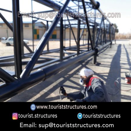 construction, color and carrying the structure, Location of metal frame factory (derrick and structures) of the aerial restaurant project in Ferdows Garden of Isfahan, Pasargad’s professional forces in welding, cutting and assembly at the factory, Steps to build the derrick for the aerial restaurant inside the factory in project of Ferdows Garden, Isfahan, Painting of project structures (with polyurethane paint, 120 microns thick) inside the factory in Ferdows Garden, Isfahan, Carrying of the project structures from the factory to the project site (in Ferdows Garden, Isfahan)
